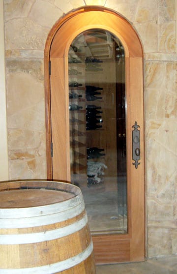 Arched Glass Wine Cellar Door with Wooden Frame: an In-Demand Door Style in Baltimore