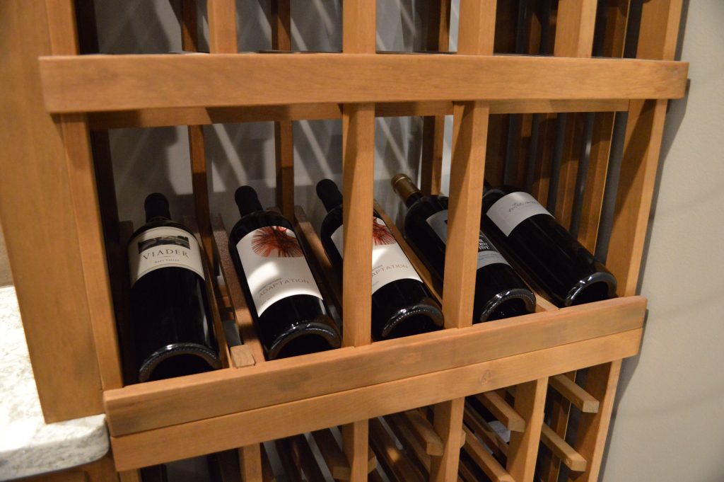 Display Row Wooden Wine Racks Utilized in Custom Wine Cellar Project in Richmond 