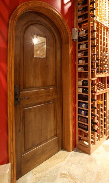 Arched Wooden Wine Cellar Door by Washington DC Builders