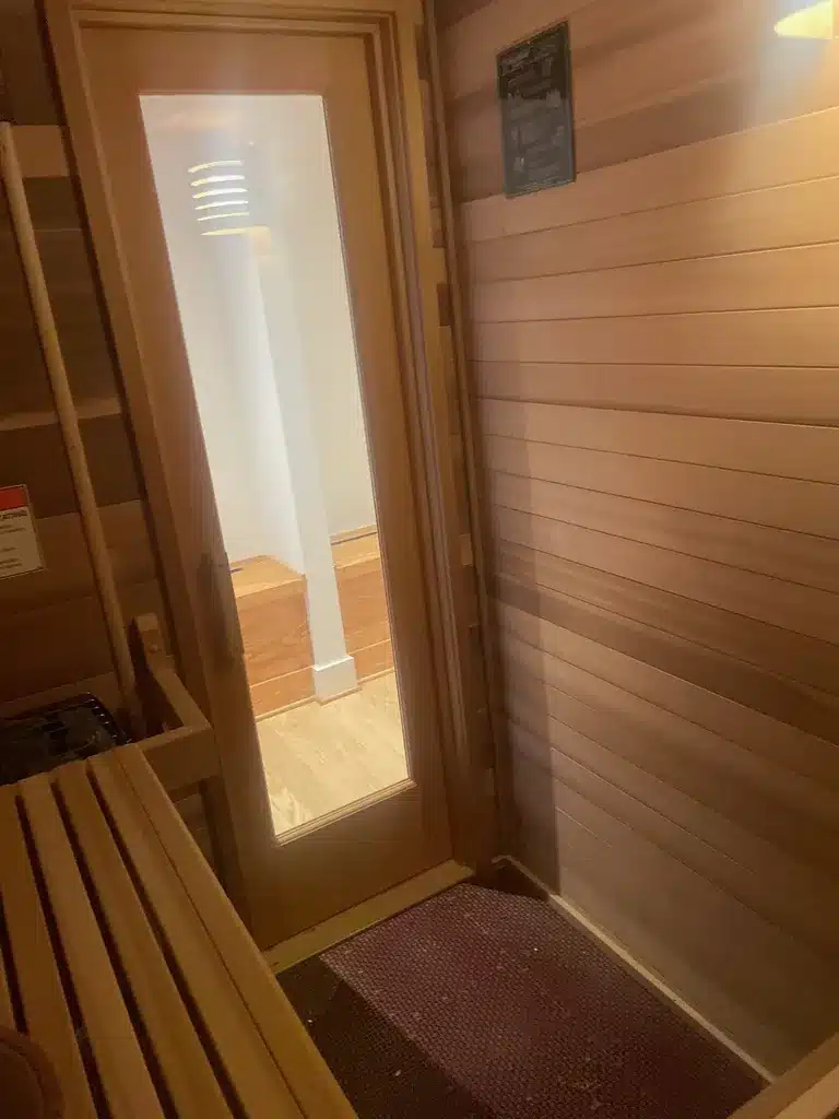 Interior view toward the glazed wood door of the Richmond home sauna