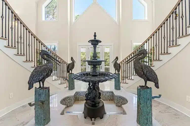 Fountain and curved staircases in the Corolla NC project home