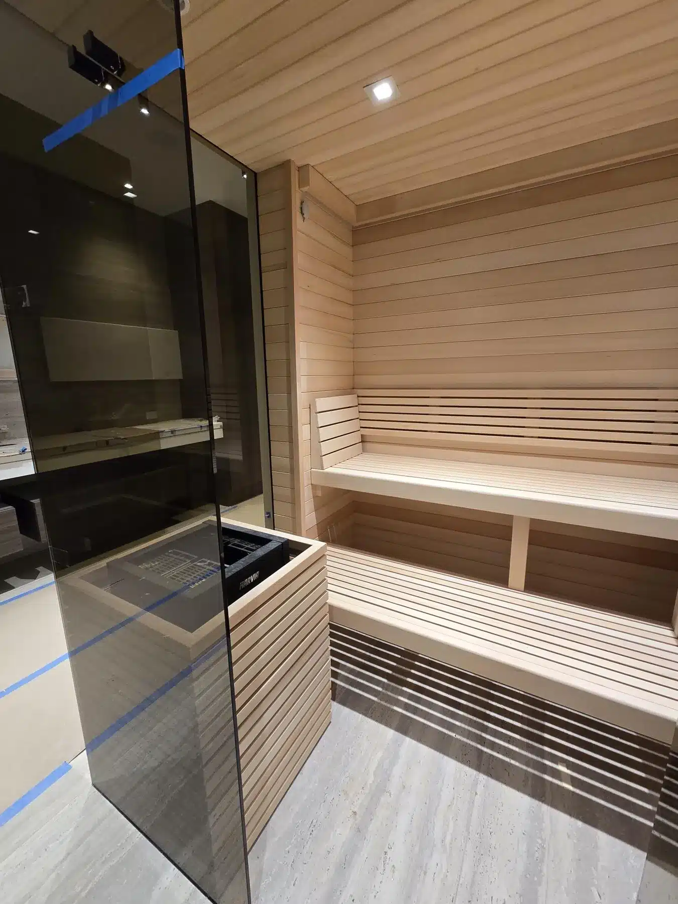Contemporary Alaska Yellow Cedar sauna with glass front and Harvia heater