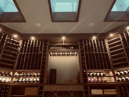 LED lighting combined with skylights are a beautiful way to add light to this amazing residential wine cellar.