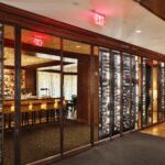 The style of this custom wine cellar in the Rosewood Hotel is a perfect combination of traditional and modern elements.