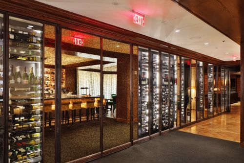 The style of this custom wine cellar in the Rosewood Hotel is a perfect combination of traditional and modern elements.