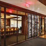 The style of this custom wine cellar in the Rosewood Hotel is a perfect combination of traditional and modern elements.