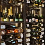 Label-Forward and Upright Bottles stored together in the Rosewood Hotel wine cellar.