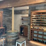 We will match your custom wine cellar to your style preferences. This homeowner chose gorgeous slate walls that look incredible with the wooden racks.