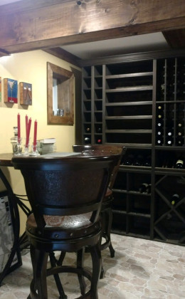 This tasting table looks great with the traditional wooden racking.