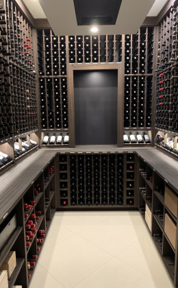 This modern home wine cellar contains gorgeous Sapele Mahogany racking with an Espresso stain. Such a beautiful way to store your wine!