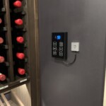 The powerful Whisperkool Ceiling Mount 8000 series in this custom home wine cellar is controlled by this small, easy to use panel.