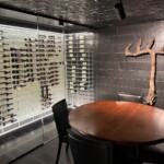 This contemporary wine cellar features a design that ties in perfectly with the very stylishly designed room.