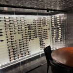 This amazing Maryland home wine cellar features incredible contemporary design in its label-forward racking, backpanels, and glass walls.