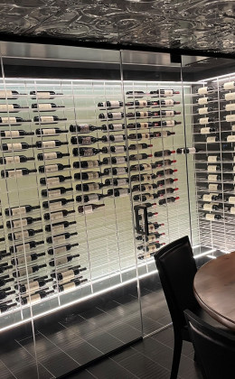 This amazing Maryland home wine cellar features incredible contemporary design in its label-forward racking, backpanels, and glass walls.