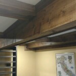 Here is a close-up of this basement wine cellar's renovation ceiling beams.