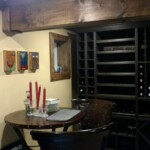 There was enough floor space to add a small wine tasting table set in this basement wine cellar.