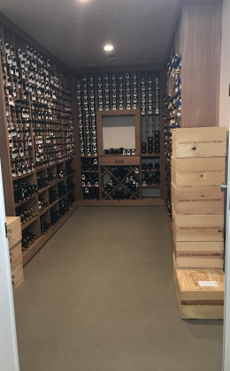 This traditional custom home wine cellar holds an amazing wine collection.