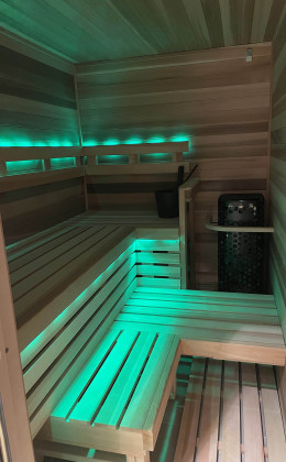 Custom LED lights provide the ambiance of this Corolla City custom home sauna. Professional Custom Home Wine Cellar North Carolina