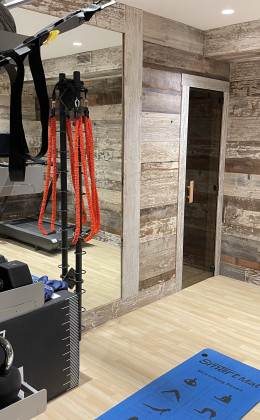 This custom home sauna in Outer Banks, North Carolina is accessible through the private gym. Custom Home Saunas Design in Outer Banks North Carolina