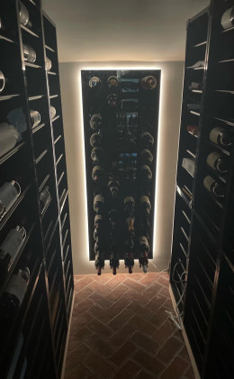 This Nags Head wine cellar features multiple wine bottle racking orientations.